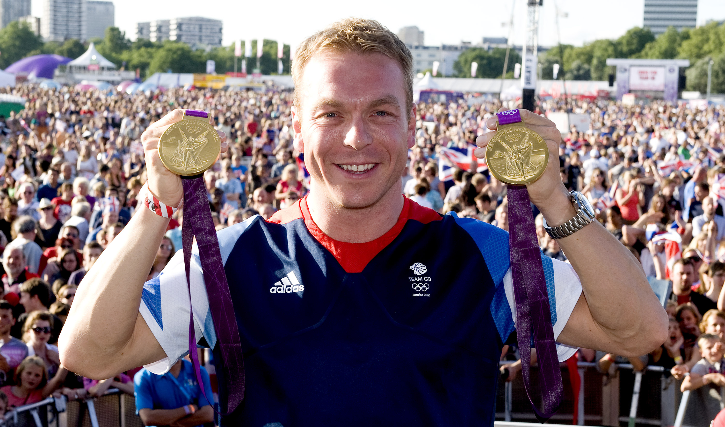 Sir Chris Hoy with his two gold medals from the London Games