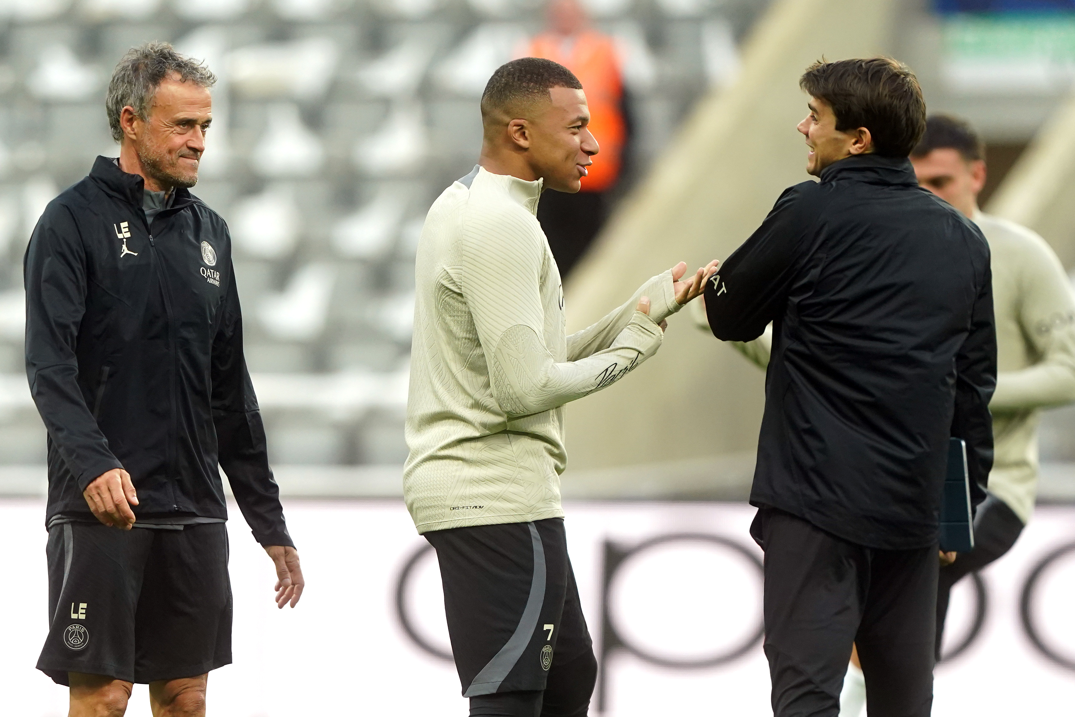 Paris Saint-Germain’s Kylian Mbappe (centre) with manager Luis Enrique (left) during a training session