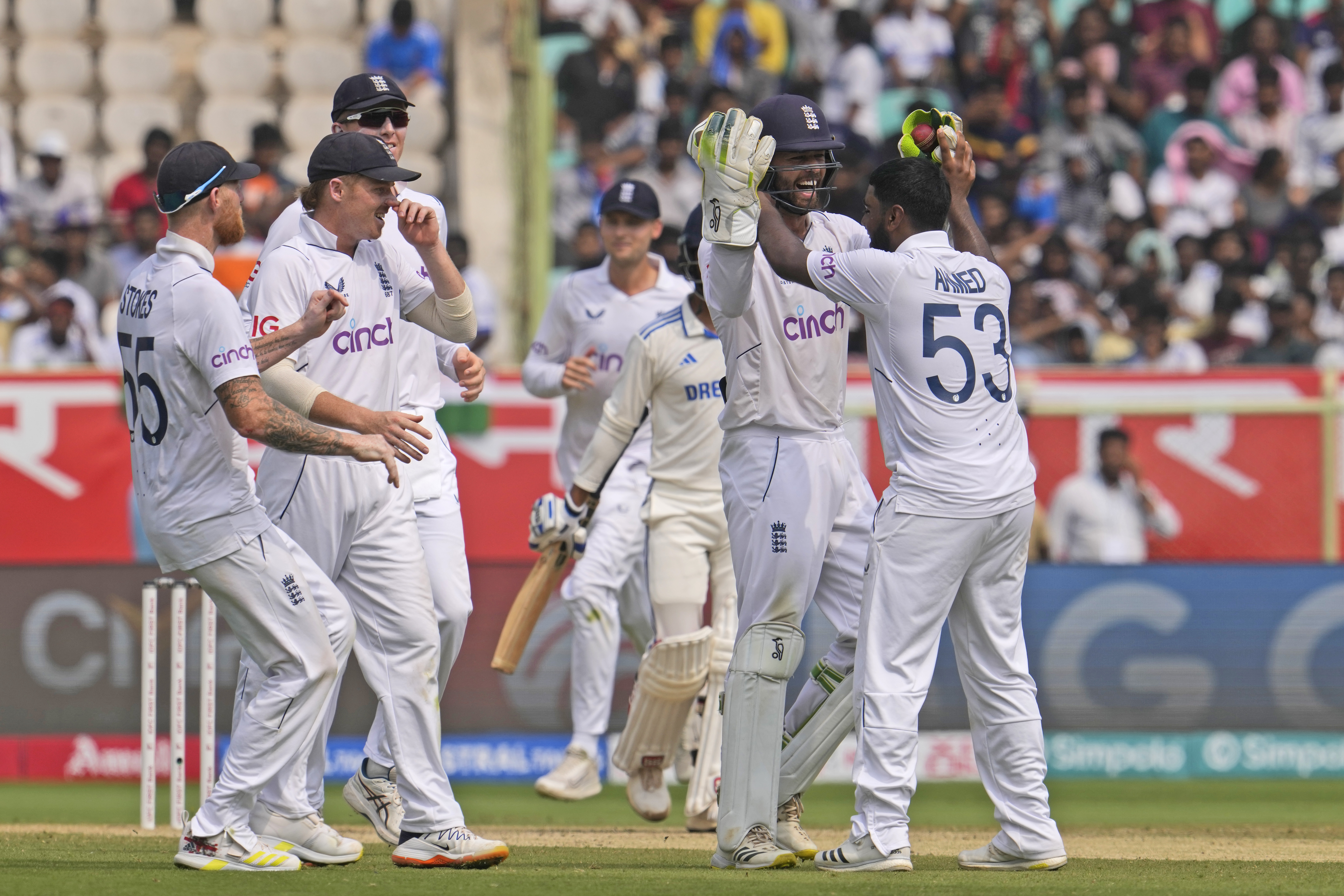 England celebrate Rehan Ahmed's removal of Rajat Patidar.