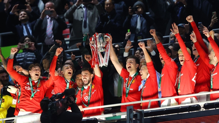 Manchester United lifting the EFL Cup trophy