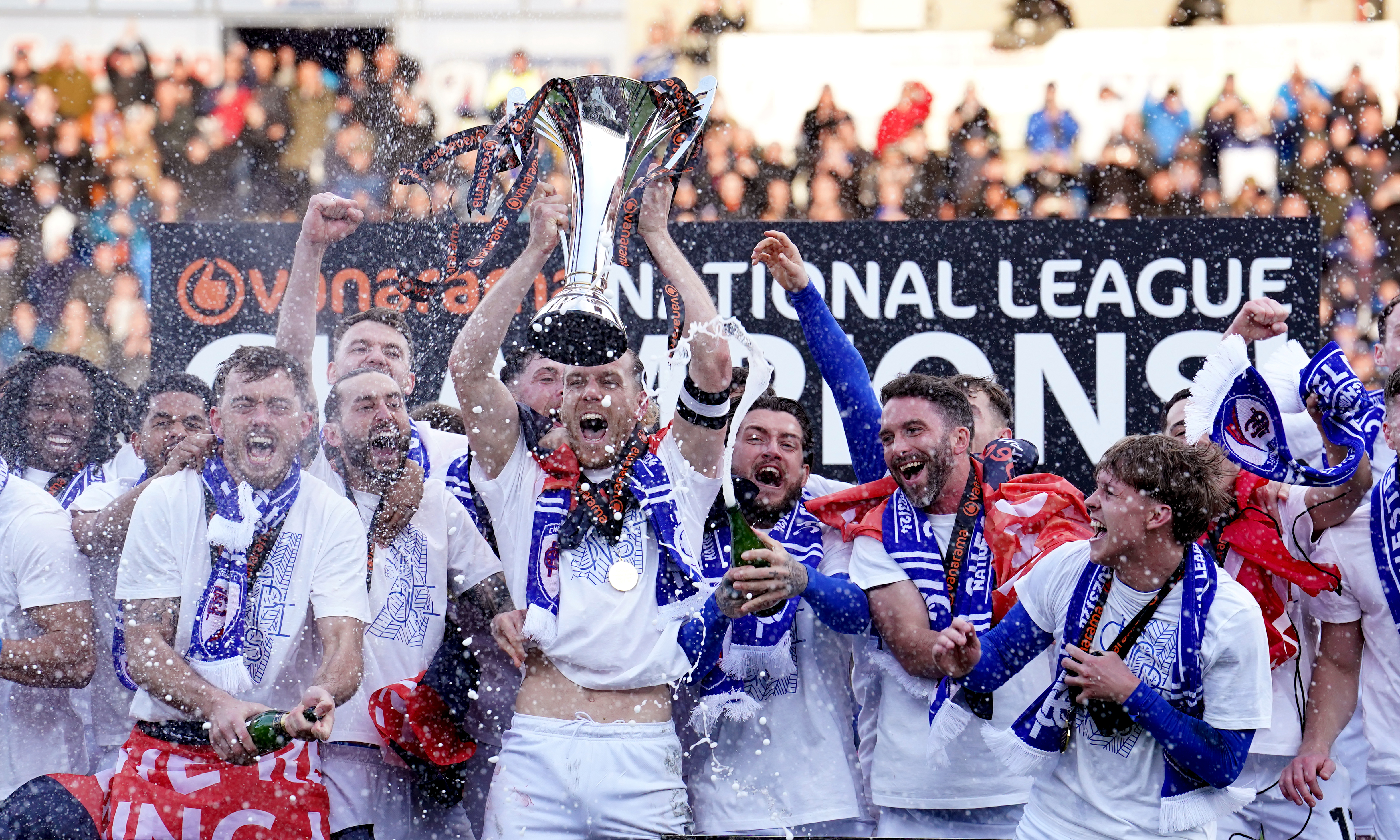 Chesterfield's Jamie Grimes celebrates with the trophy