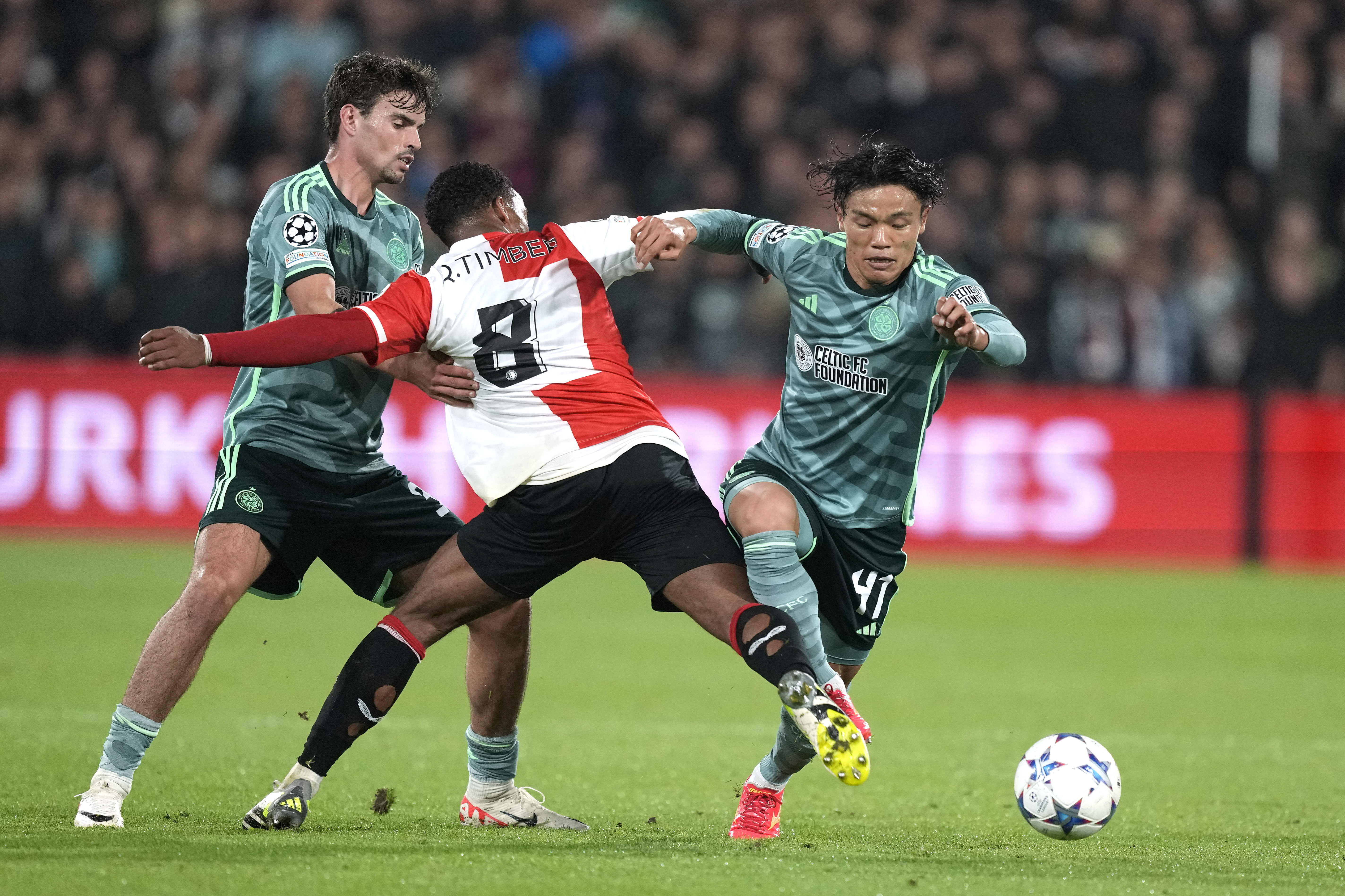 Celtic’s Reo Hatate, right