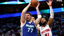 Luka Doncic grabbing one of his eight rebounds against the Pistons