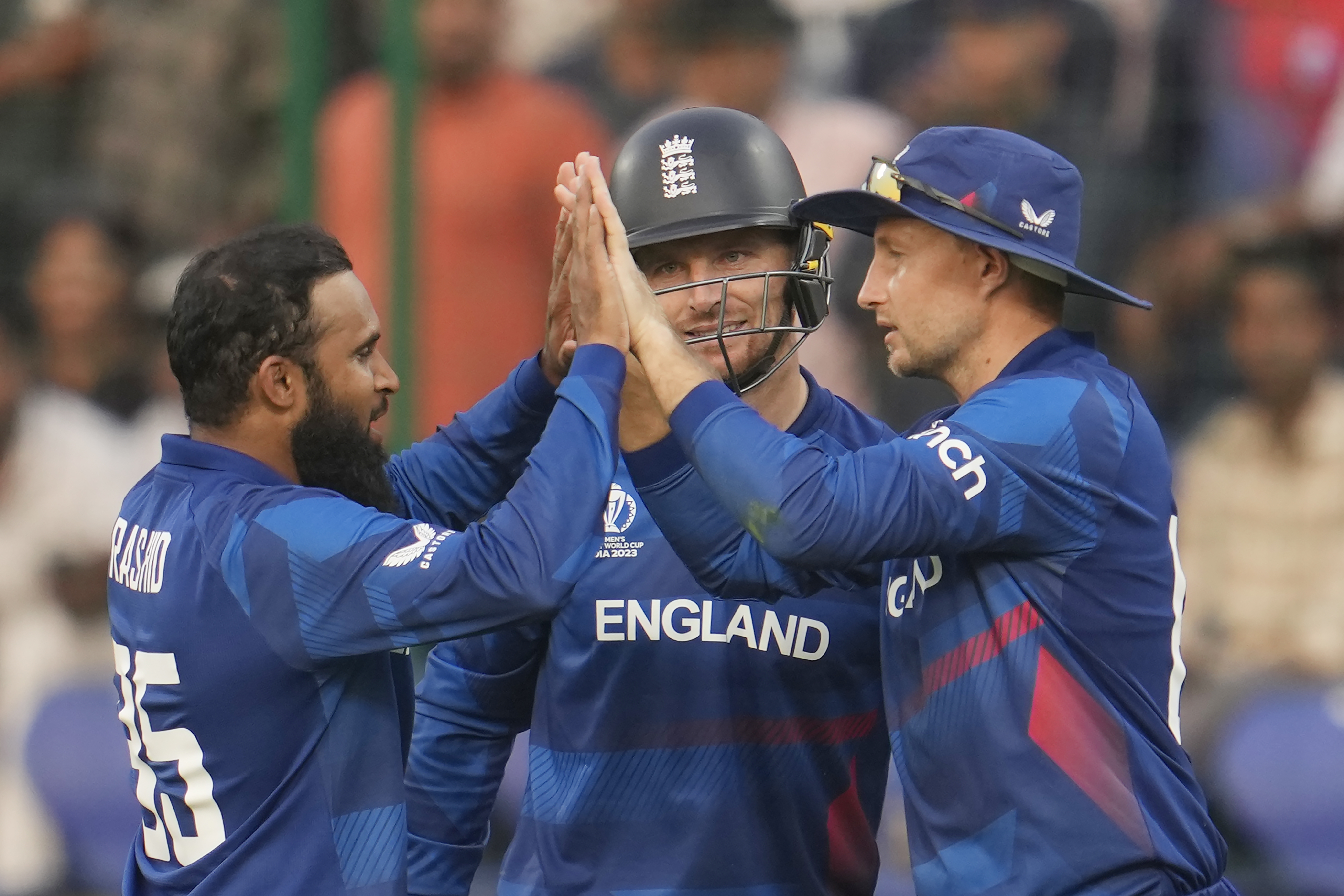 Adil Rashid, left, took three for 42 to help England gain control
