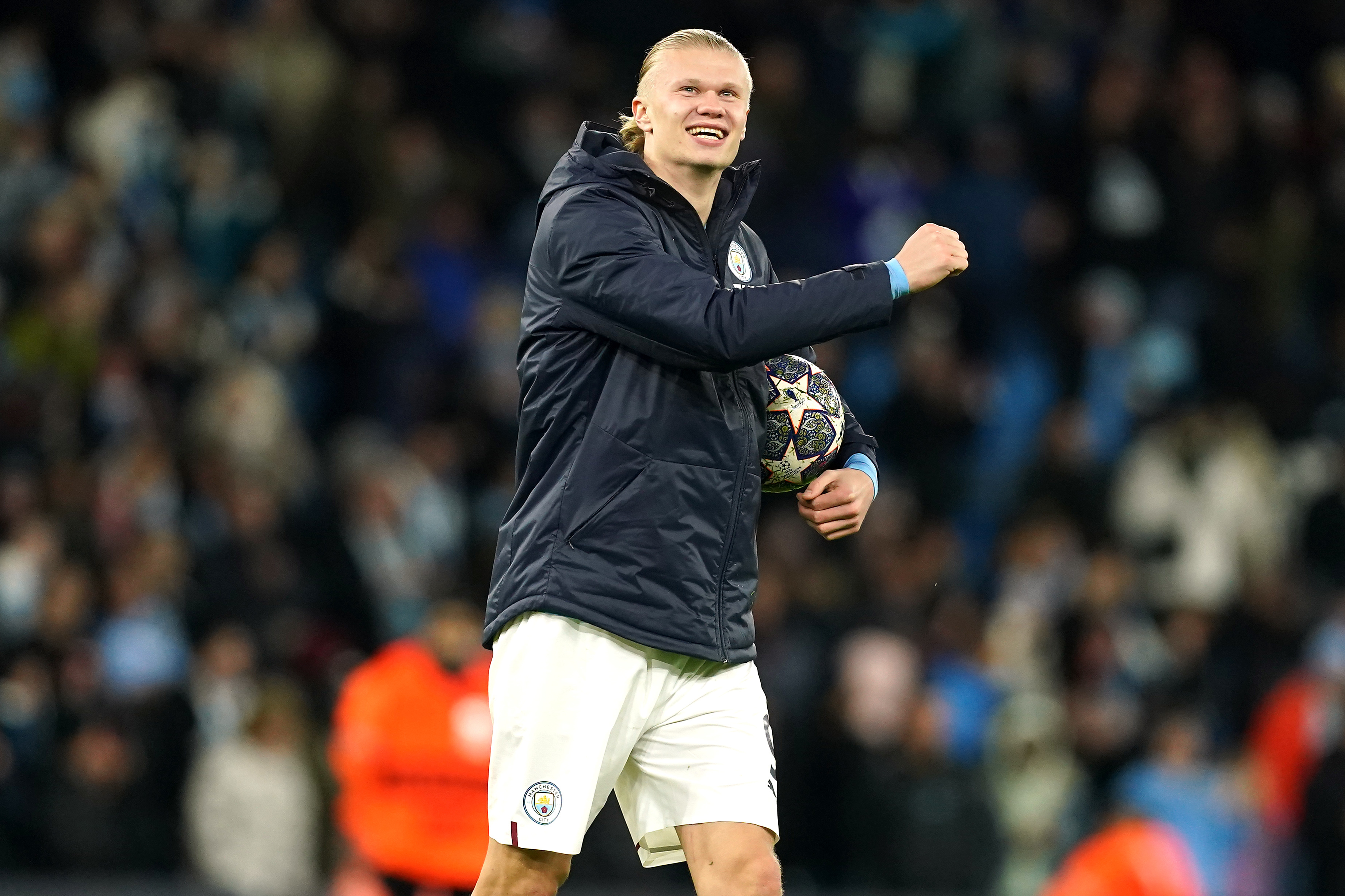 Erling Haaland celebrates with the match ball after scoring five goals against RB Leipzig