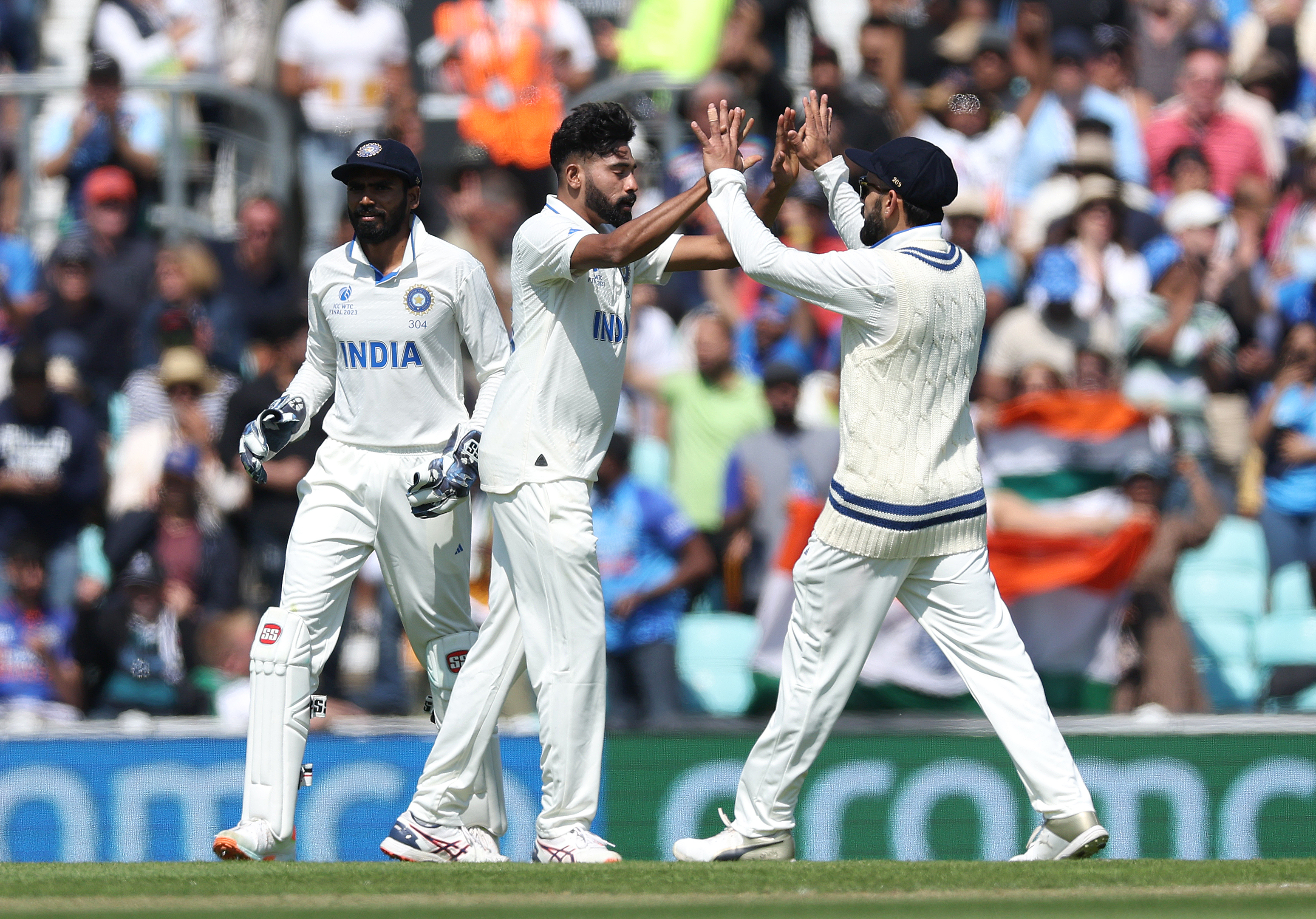 India’s Mohammed Siraj (centre) celebrates the dismissal of Travis Head