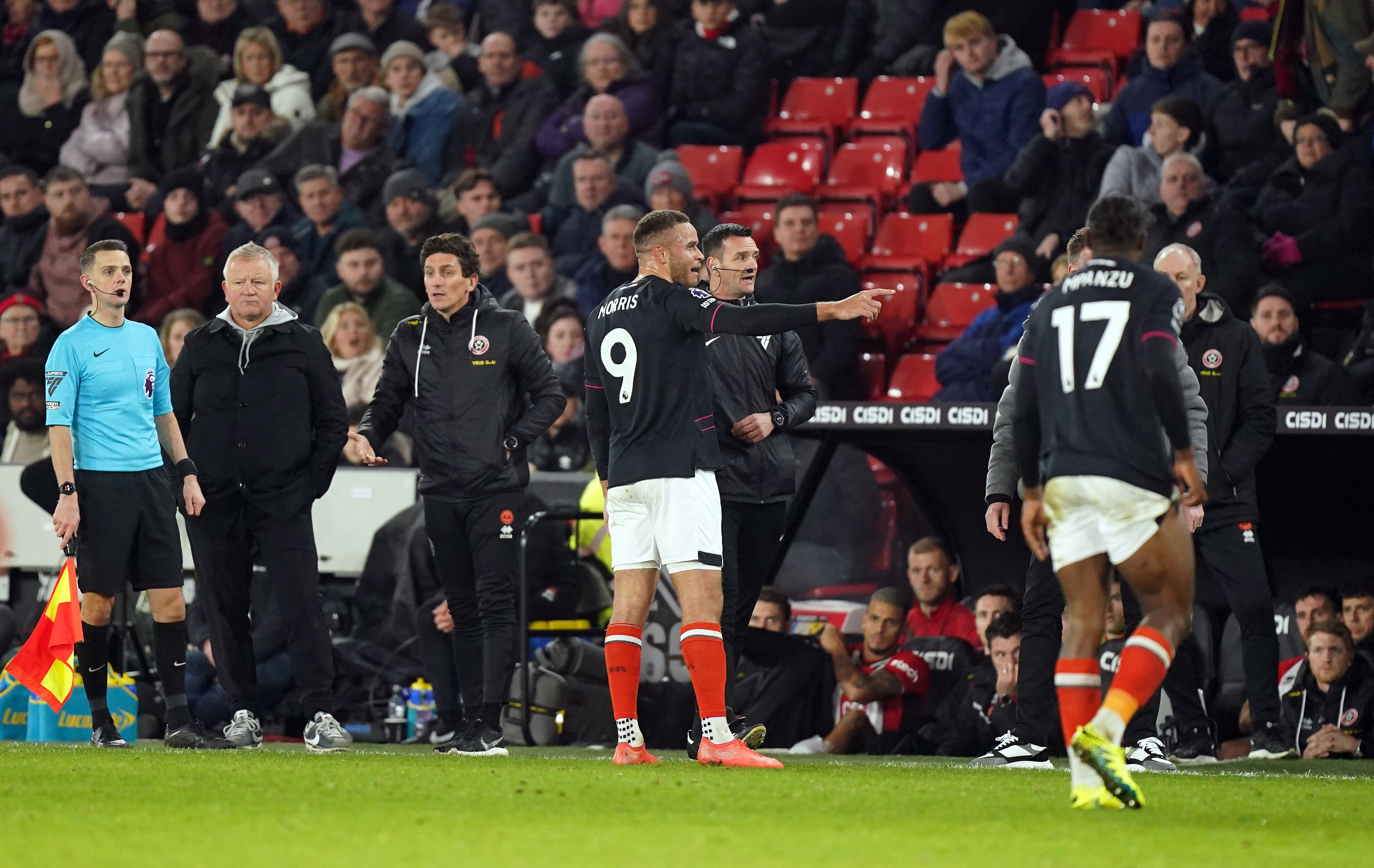 Carlton Morris talking to the fourth official