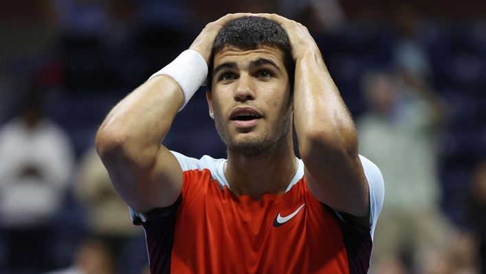 Carlos Alcaraz pauses to take in the moment of victory