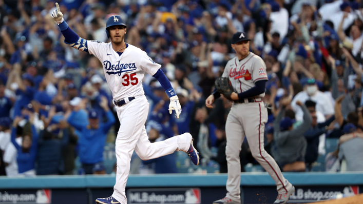 Cody Bellinger #35 of the Los Angeles Dodgers reacts as he hits a 3-run home run during the 8th inning of Game 3 of the National League Championship Series against the Atlanta Braves at Dodger Stadium
