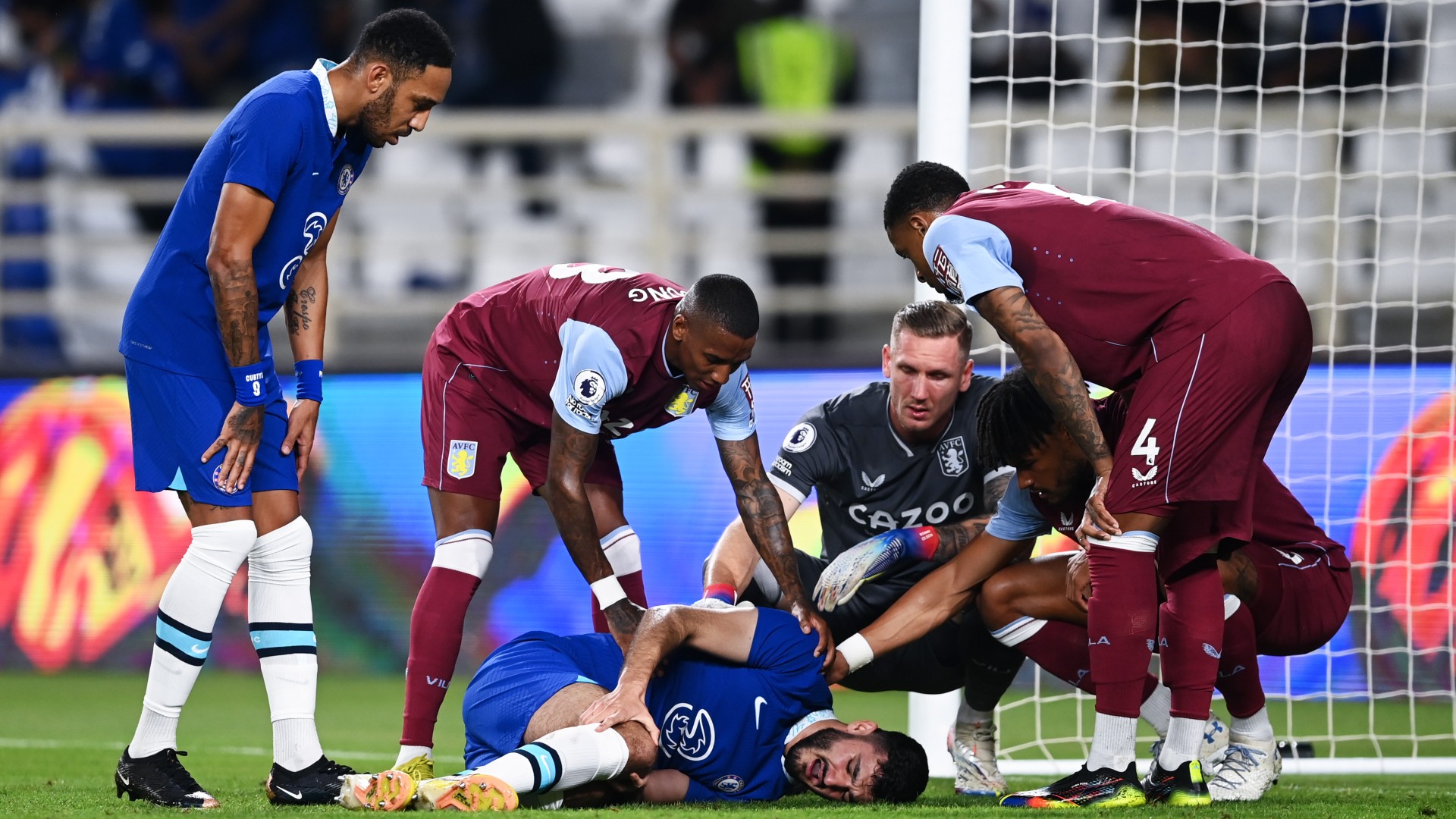 Armando Broja is consoled by Aston Villa players after going down injured in Sunday's friendly