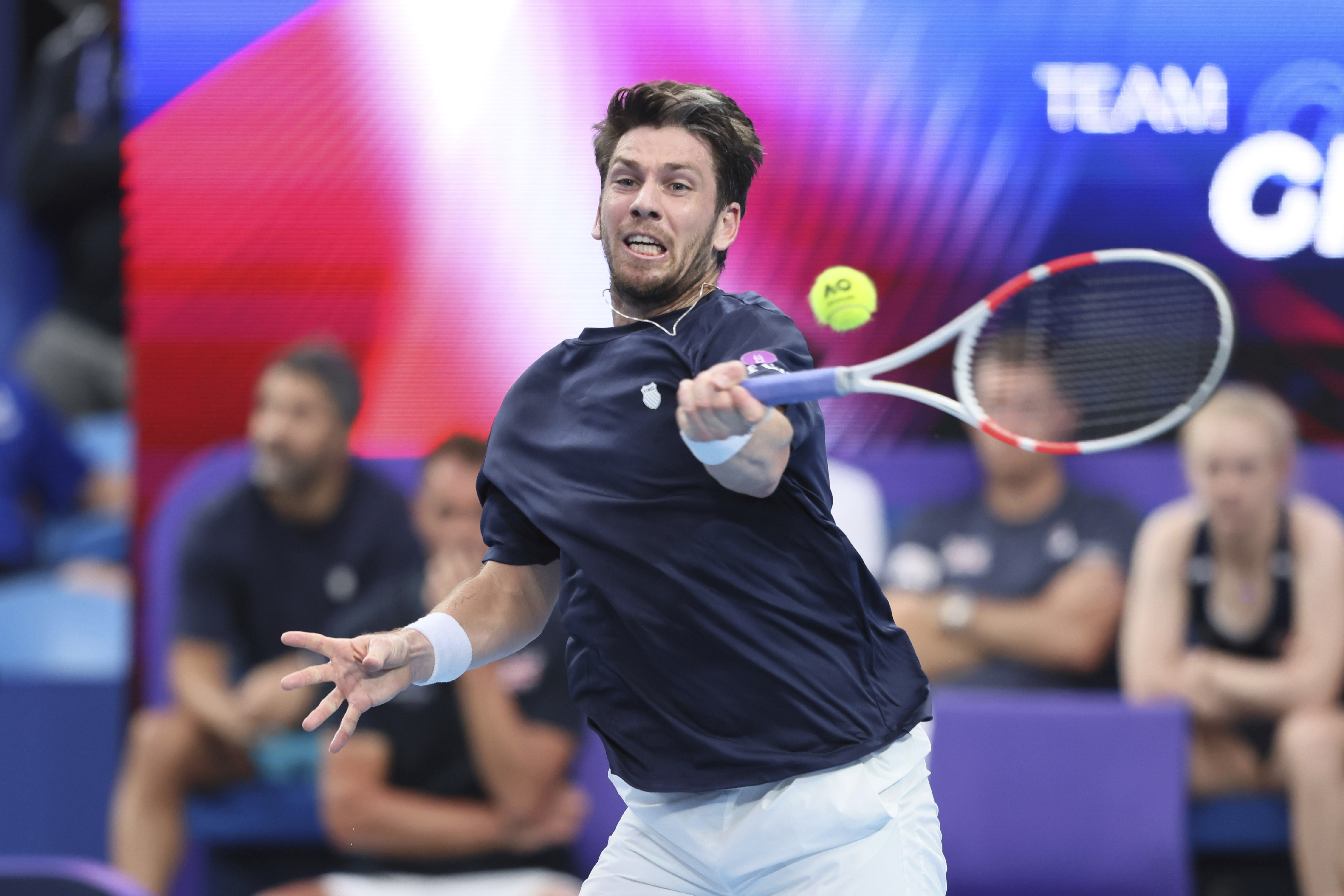 Cameron Norrie hits a forehand