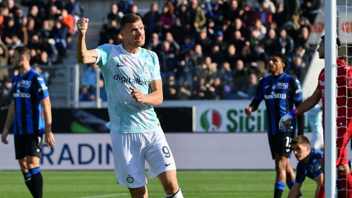 Edin Dzeko celebrates one of two goals on Sunday