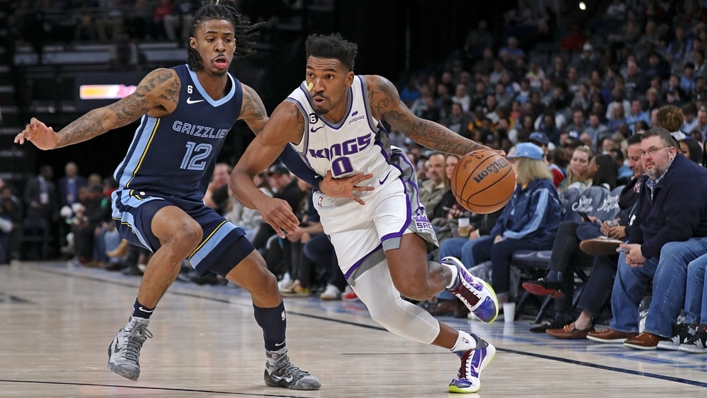 Kings guard Malik Monk drives past Ja Morant in his team's seventh consecutive win