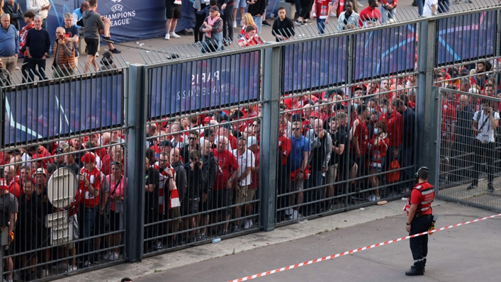 Liverpool supporters queue to get into the Stade de France