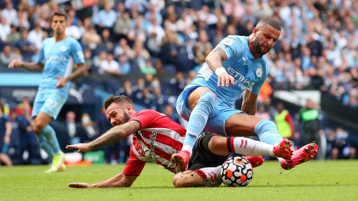 Adam Armstrong goes down under a challenge from Kyle Walker