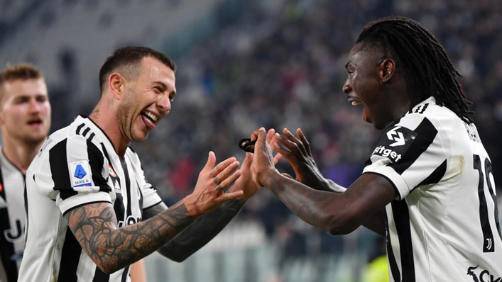 Moise Kean (r) celebrates scoring for Juventus against Cagliari