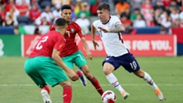 Christian Pulisic weaves his way through the Moroccan defence