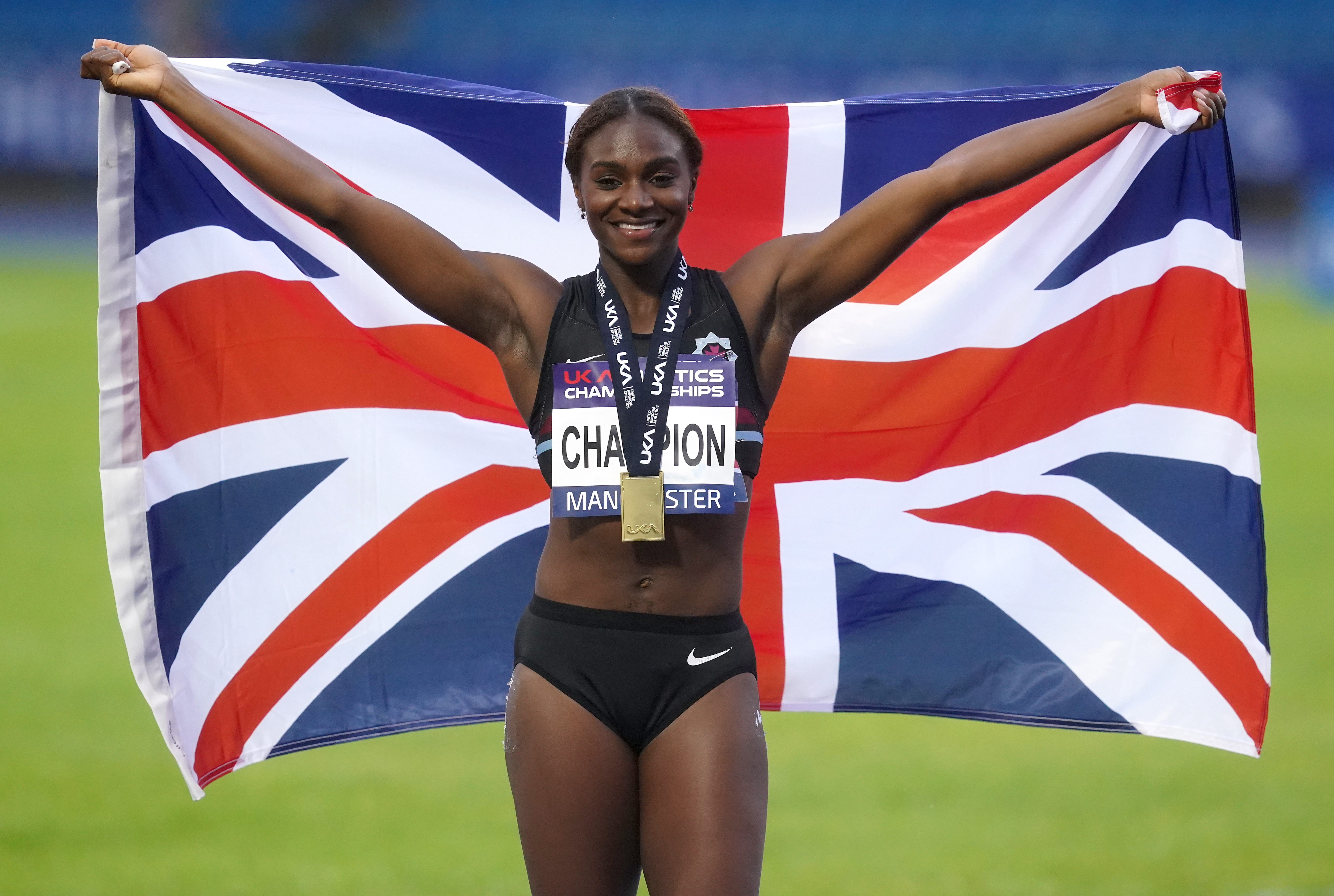 Dina Asher-Smith celebrates winning the women’s 100m at the British Championships in Manchester (Martin Rickett/PA)