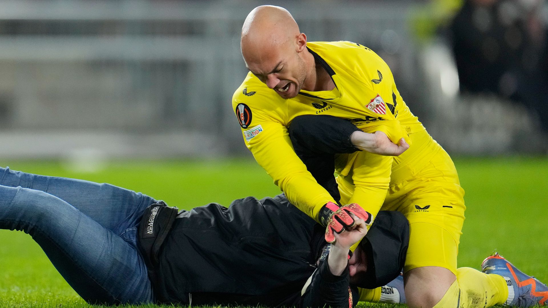 Marko Dmitrovic pins his attacker during PSV's win over Sevilla