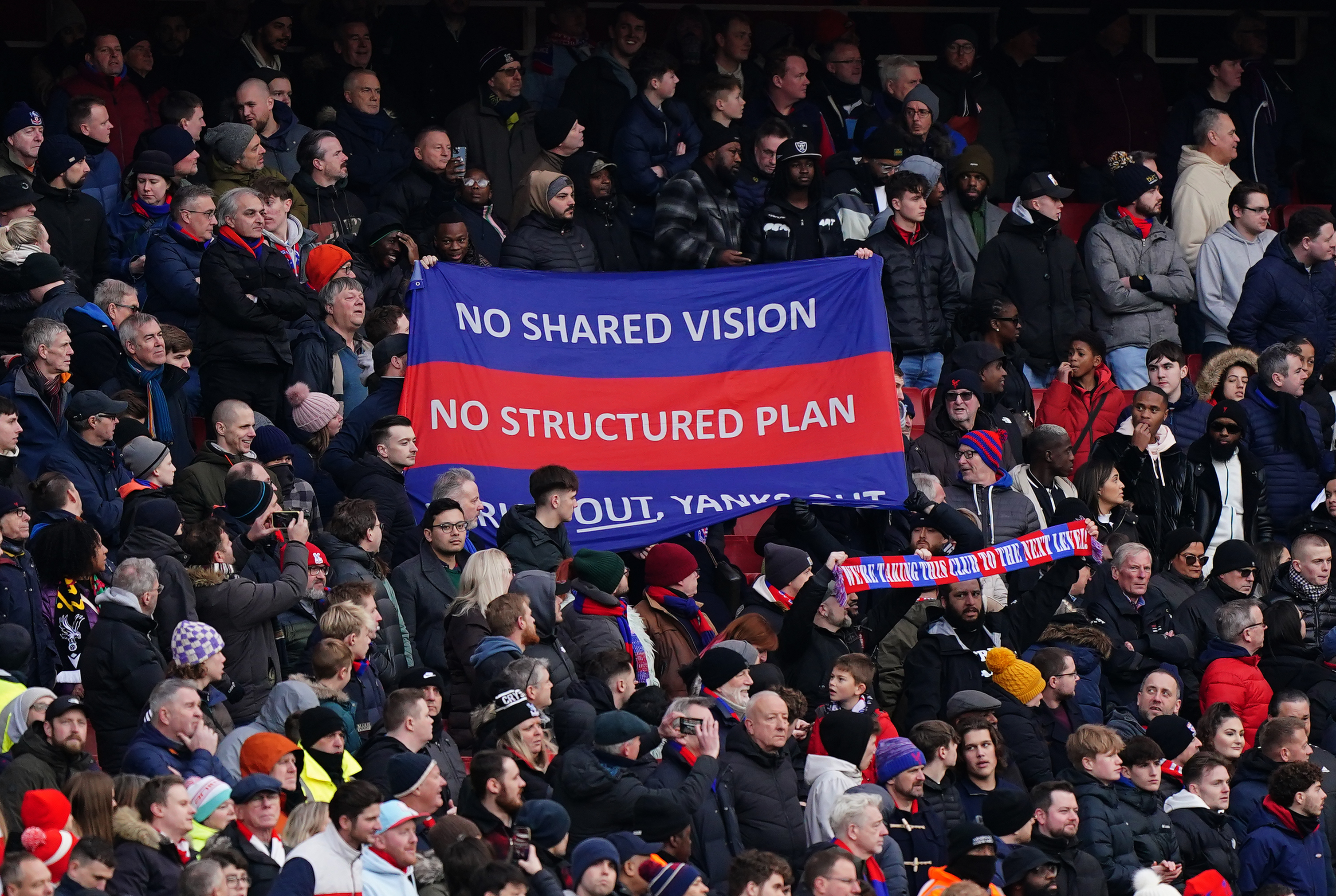 Crystal Palace fans unveil a banner in the stands