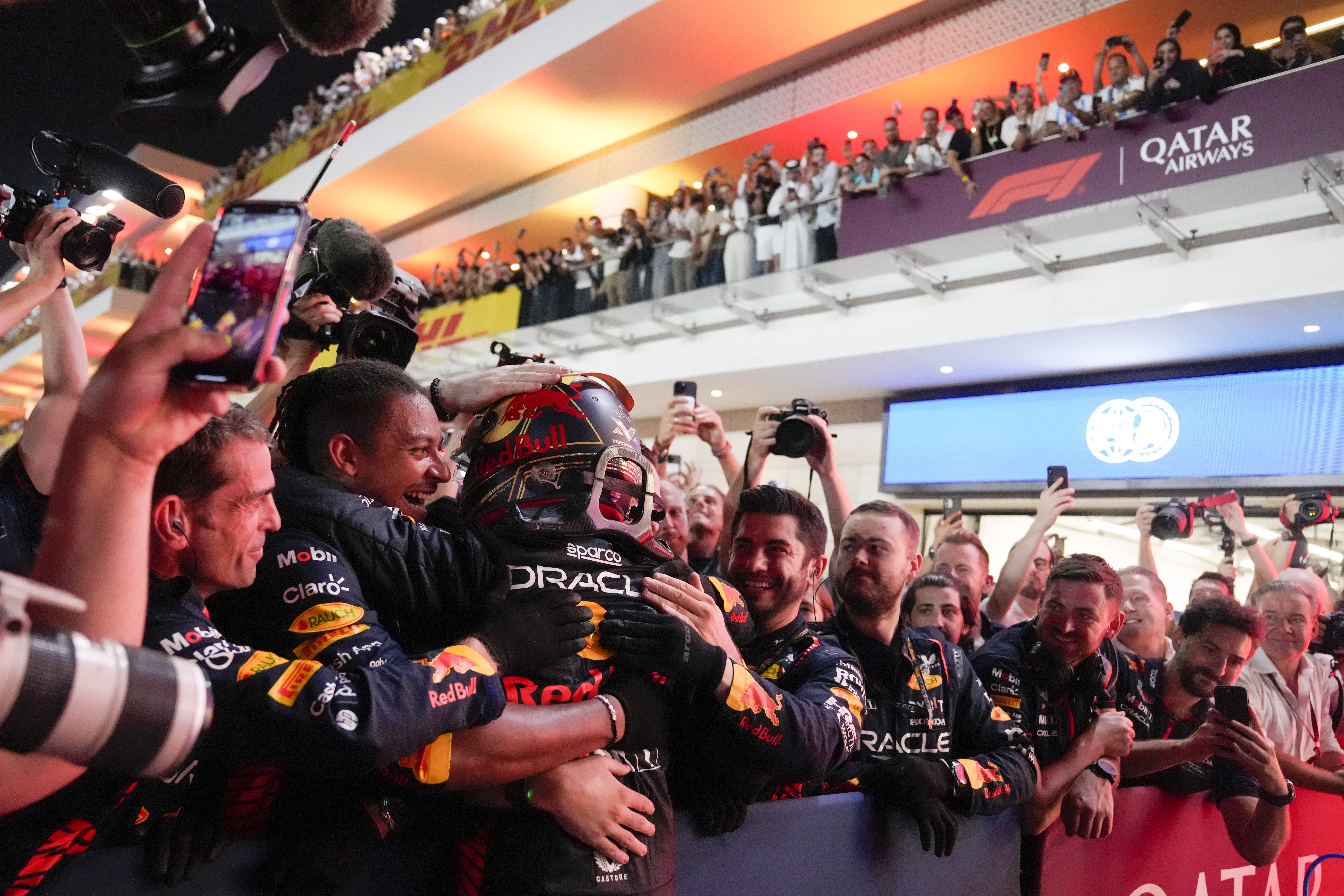 Red Bull's Max Verstappen celebrated his third straight Formula One world title after victory in the Qatar Gran Prix in Lusail