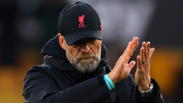 Jurgen Klopp applauds Liverpool's supporters following the loss at Wolves