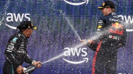 Lewis Hamilton and Max Verstappen celebrate on the podium in Barcelona (Joan Monfort/AP)