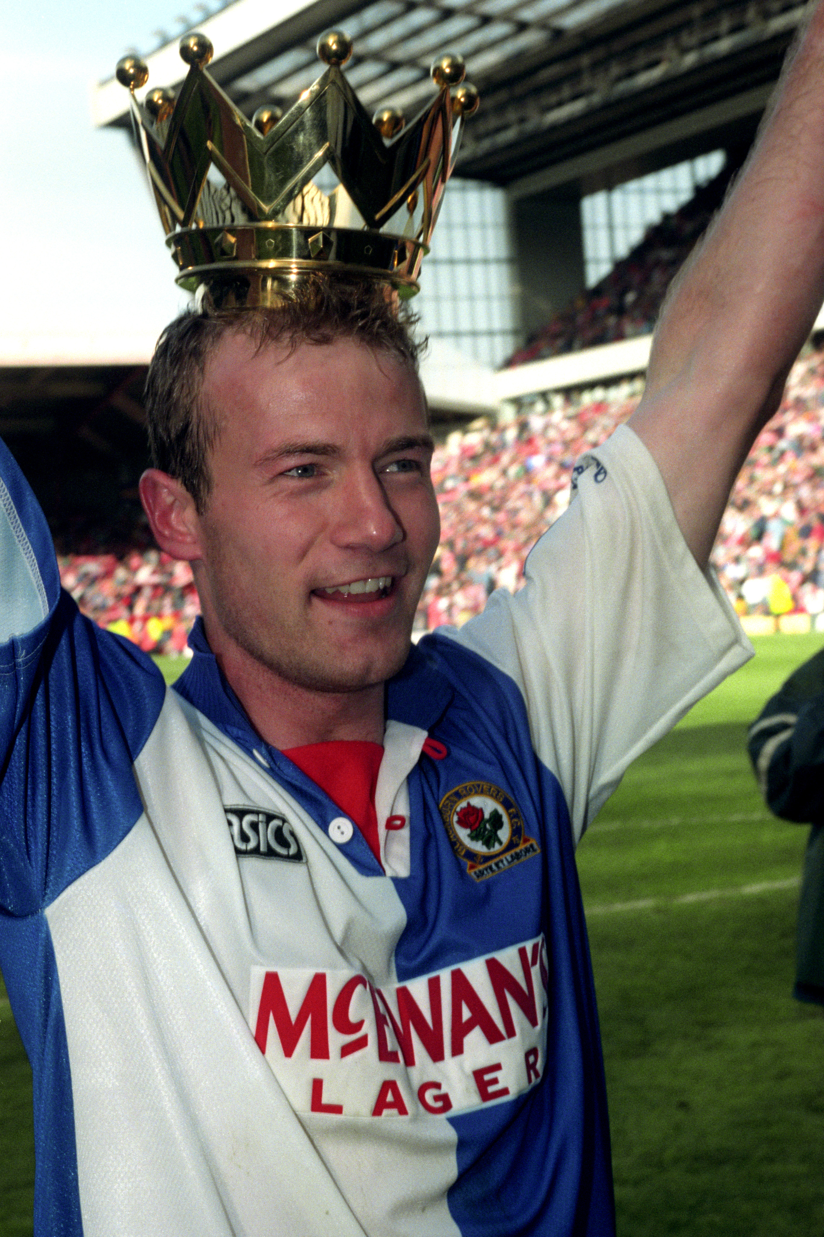 Alan Shearer wears the crown from the Premier League trophy after his 34 goals led Blackburn to the title
