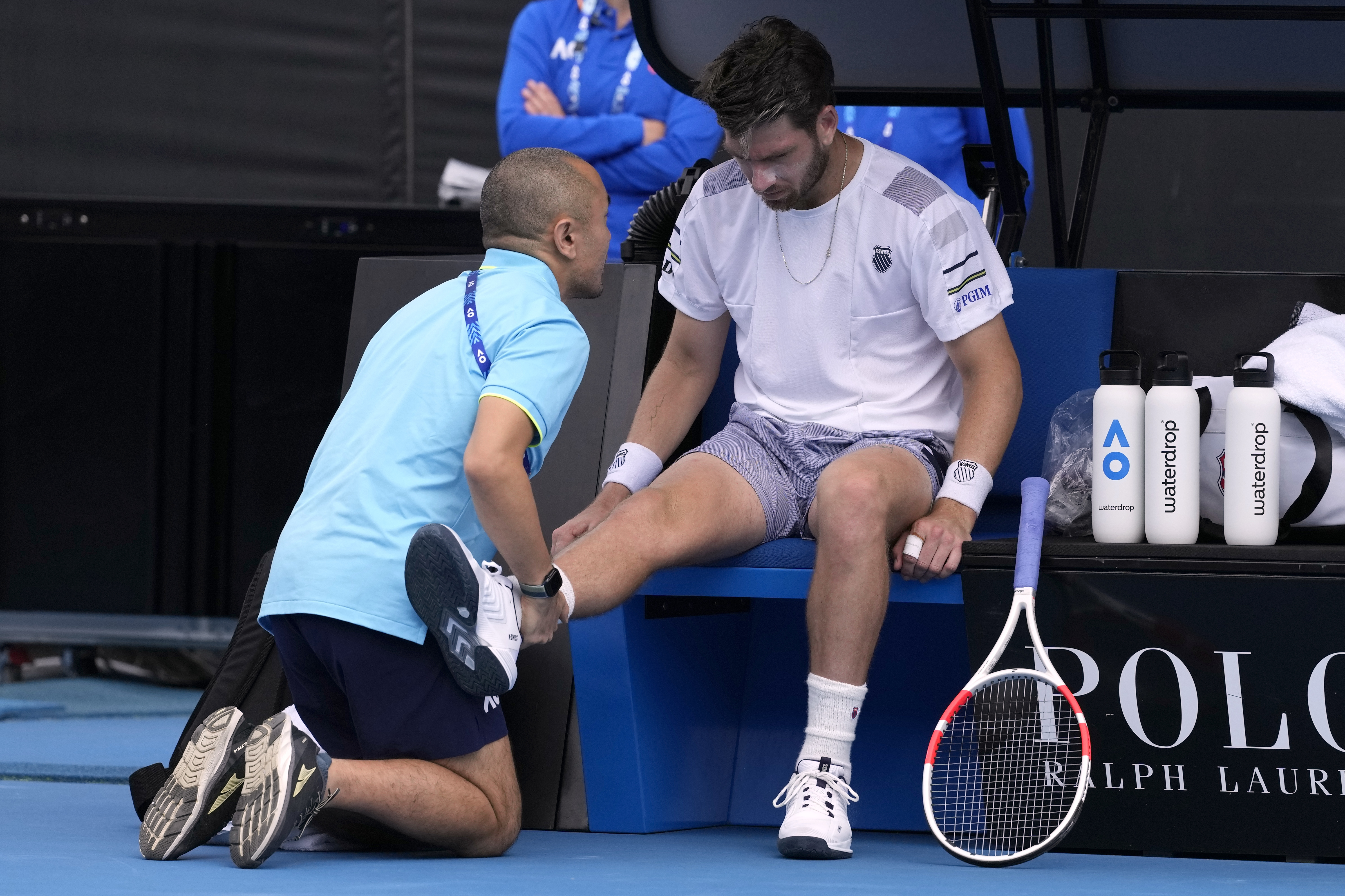 Cameron Norrie receives treatment to his right knee