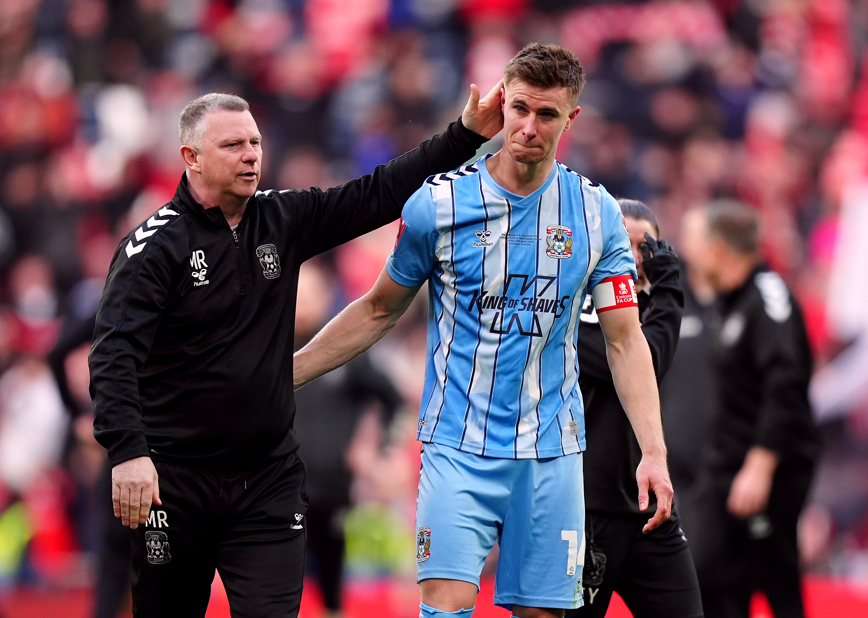 Coventry manager Mark Robins consoles Ben Sheaf