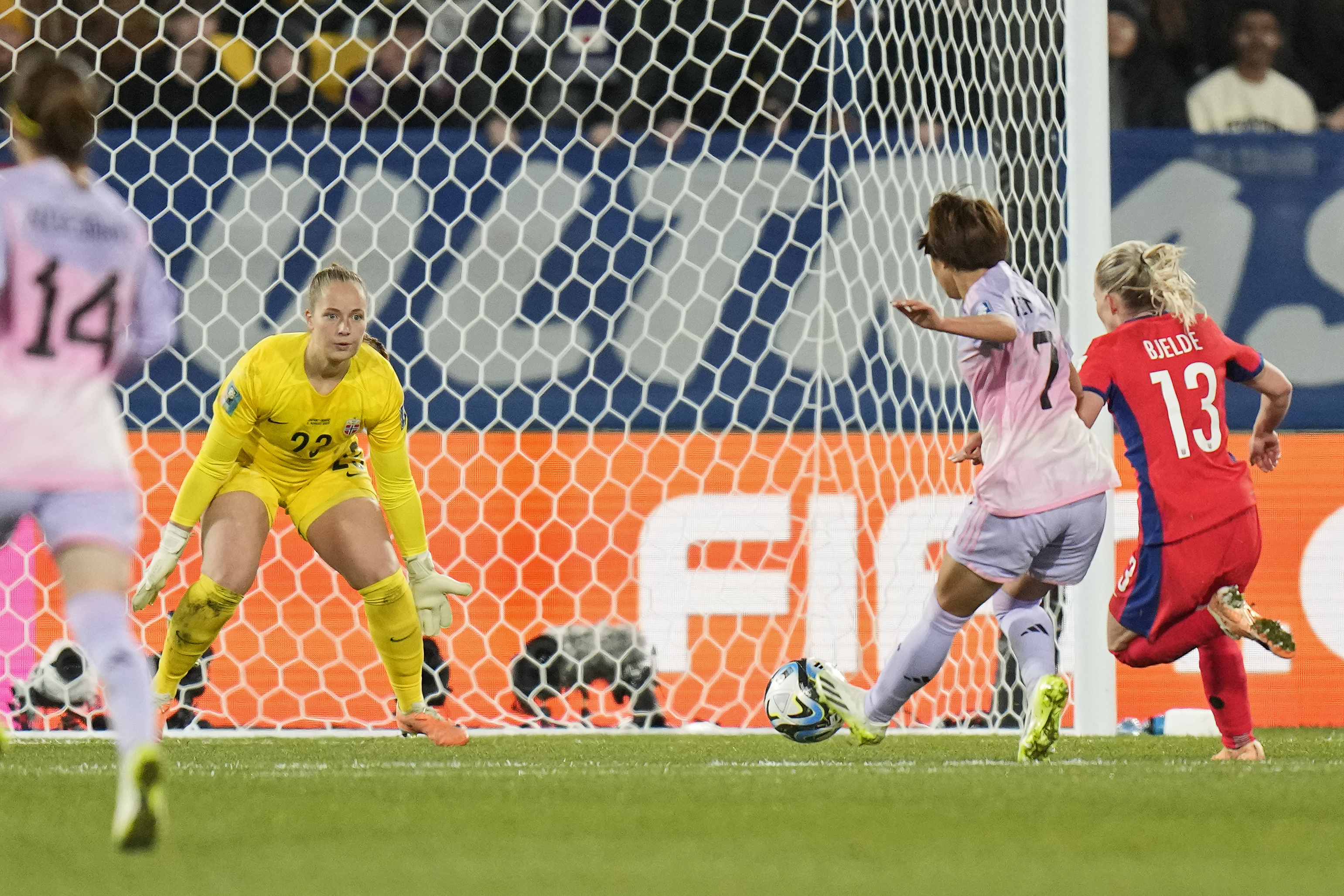 Hinata Miyazawa, centre right, scores for Japan against Norway