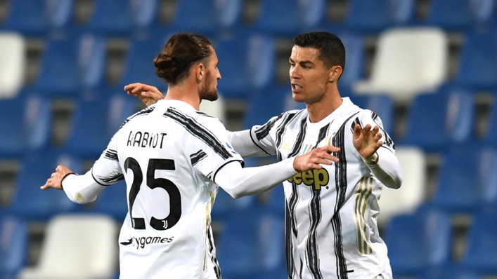 Juventus midfielder Adrien Rabiot celebrates with Cristiano Ronaldo