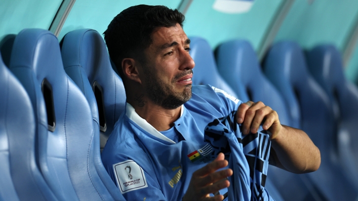 Luis Suarez sits alone and in tears after Uruguay's World Cup exit