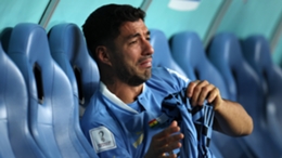 Luis Suarez sits alone and in tears after Uruguay's World Cup exit