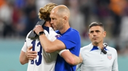 Gregg Berhalter consoles Tim Ream in the aftermath of the United States' World Cup elimination