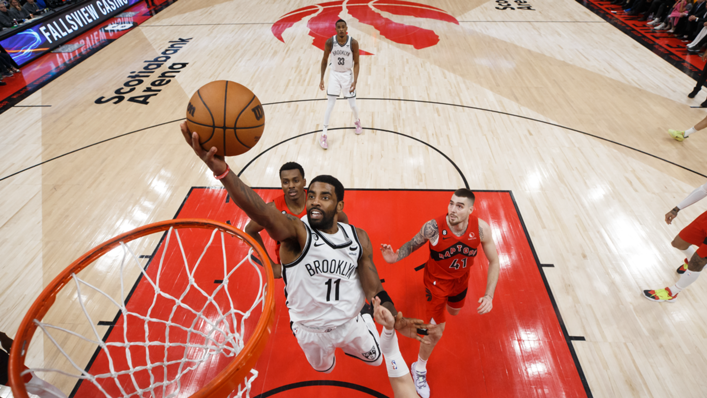 Kyrie Irving of the Brooklyn Nets drives to the net during the second half of their NBA game against the Toronto Raptors