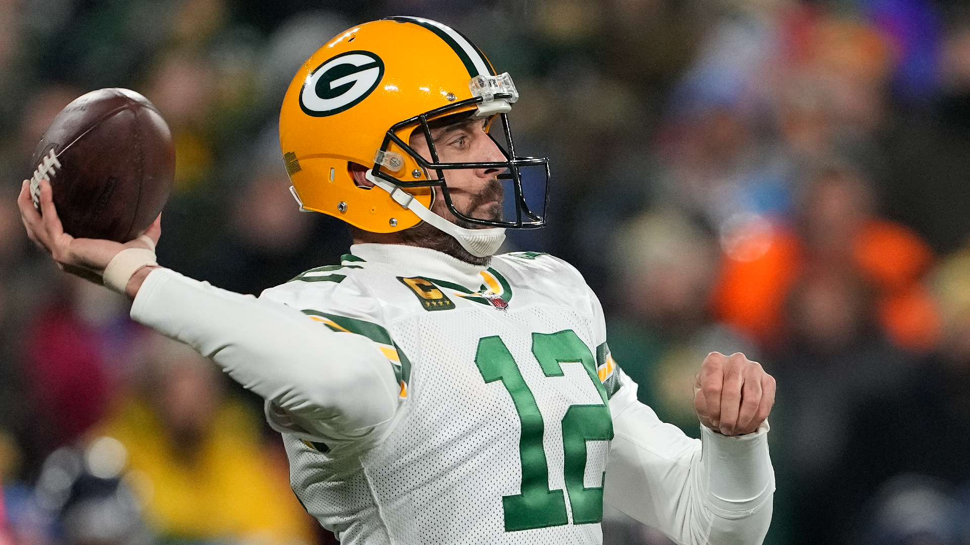 Aaron Rodgers of the Green Bay Packers looks to throw a pass against the Tennessee Titans