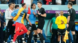 Uruguay players Fernando Muslera, Edinson Cavani and Jose Gimenez remonstrate with Daniel Siebert following their 2-0 win over Ghana