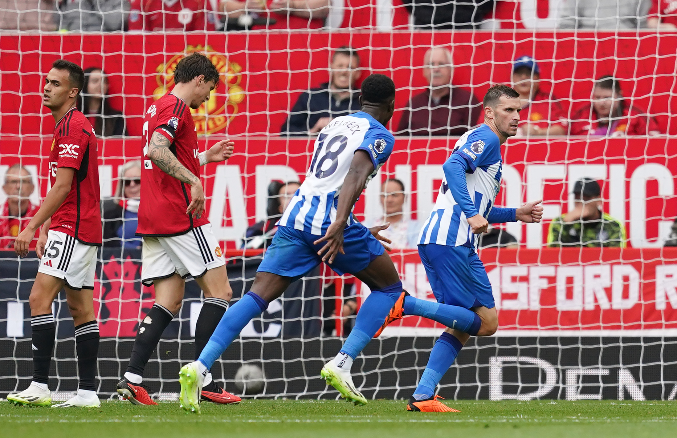 Pascal Gross celebrates after scoring against Manchester United (Martin Rickett/PA)