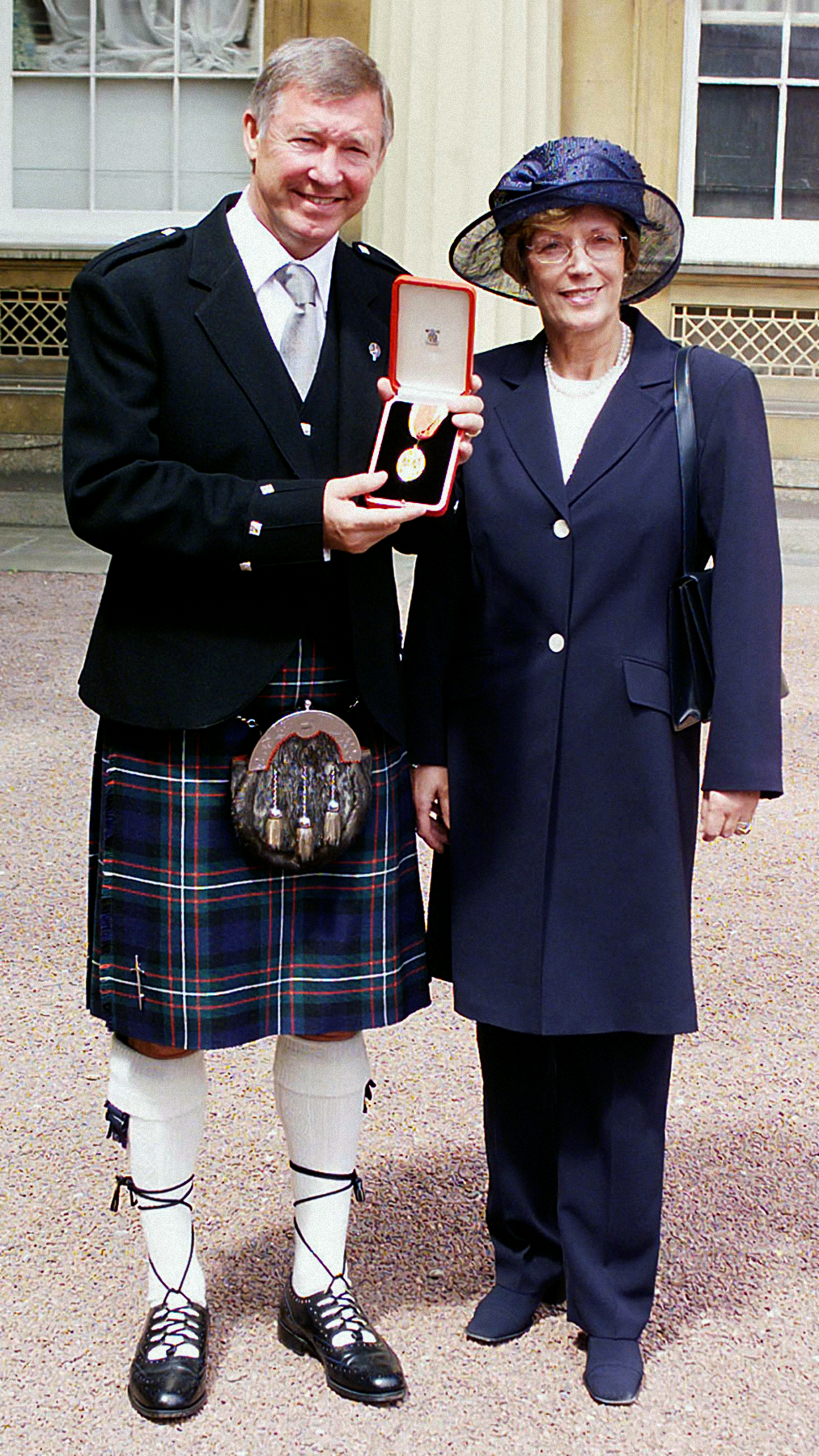Sir Alex Ferguson with his wife Cathy, right, after he was knighted in 1999
