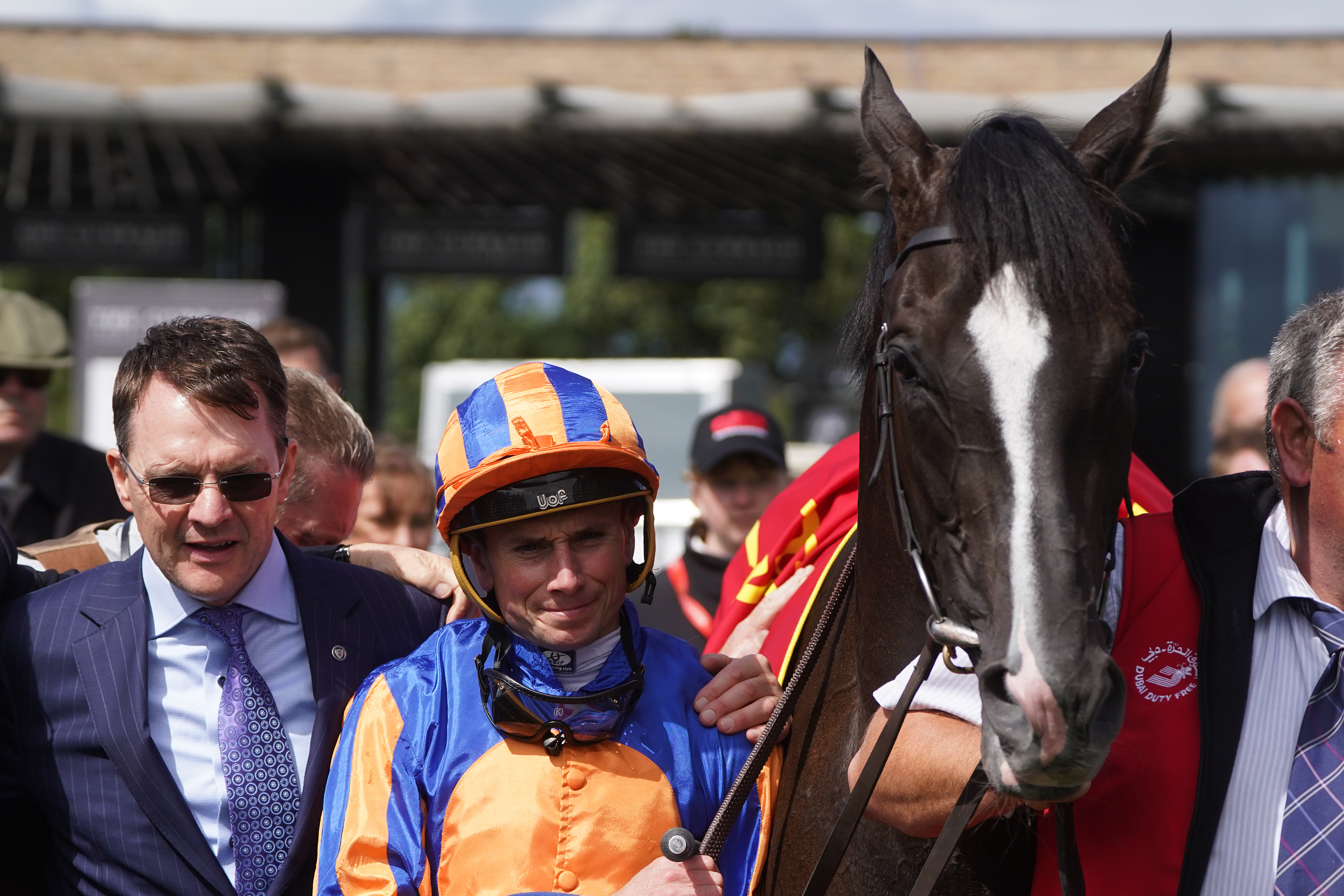 Auguste Rodin with trainer Aidan O’Brien and jockey Ryan Moore after winning the Dubai Duty Free Irish Derby
