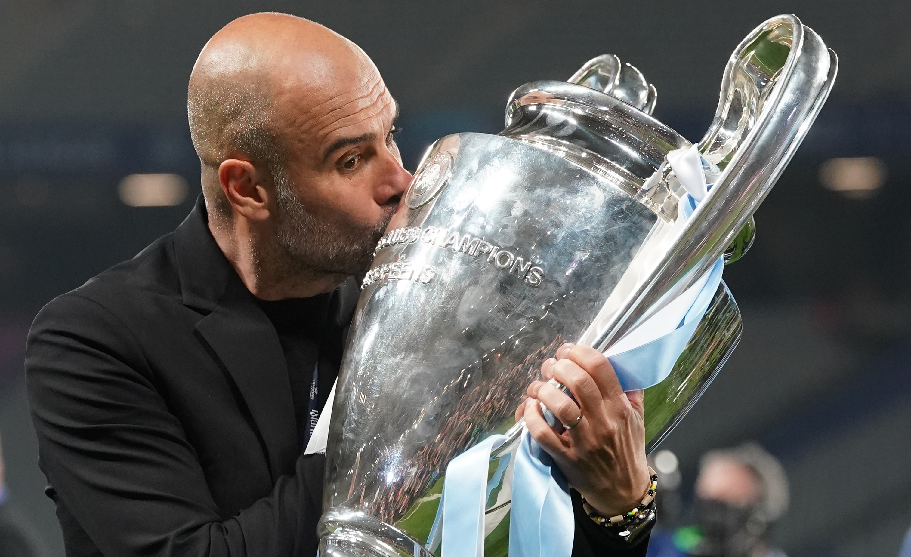 Manchester City manager Pep Guardiola kisses the Champions League trophy