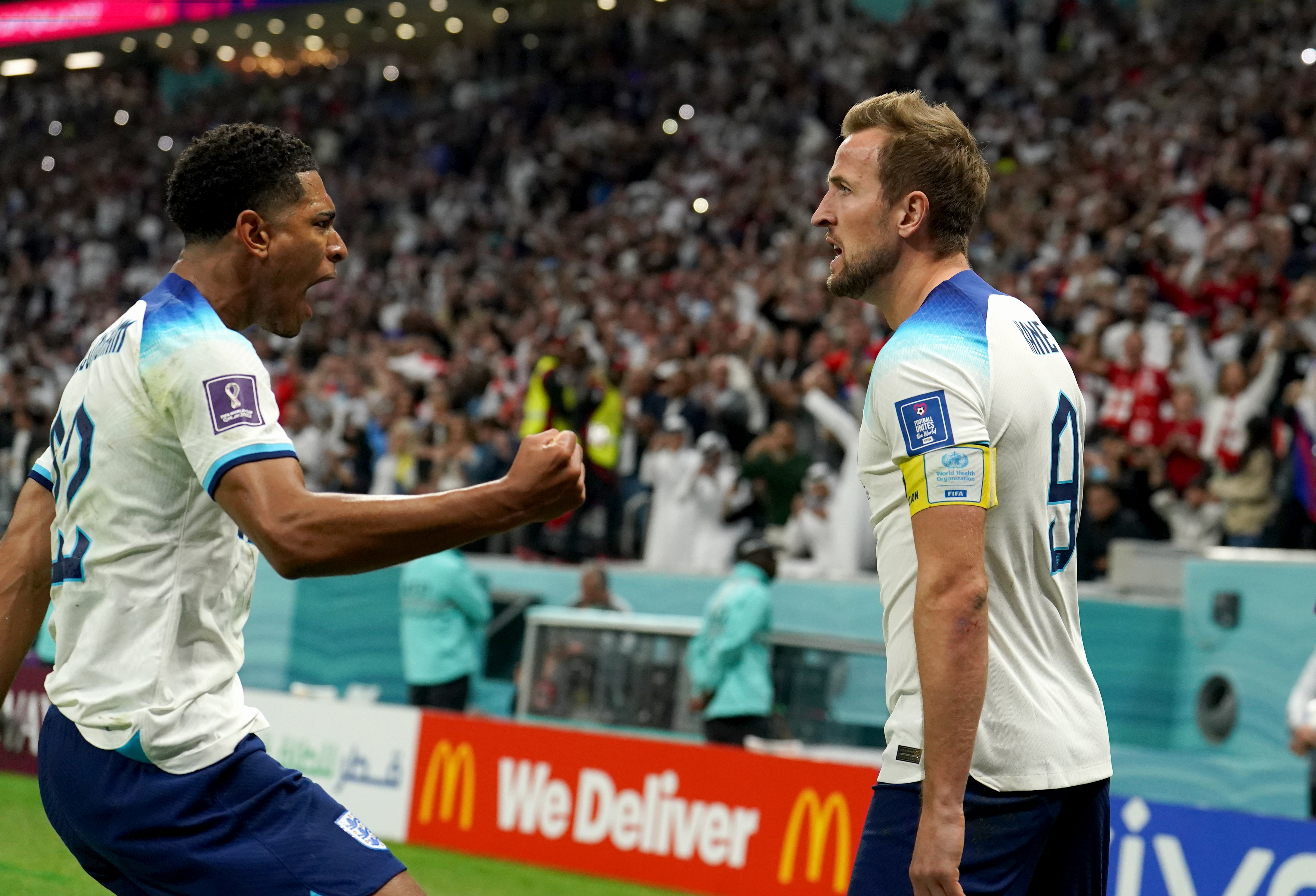 England’s Harry Kane (right) celebrates with Jude Bellingham after scoring their side’s first goal of the game from the penalty spot during the World Cup quarter-final against France