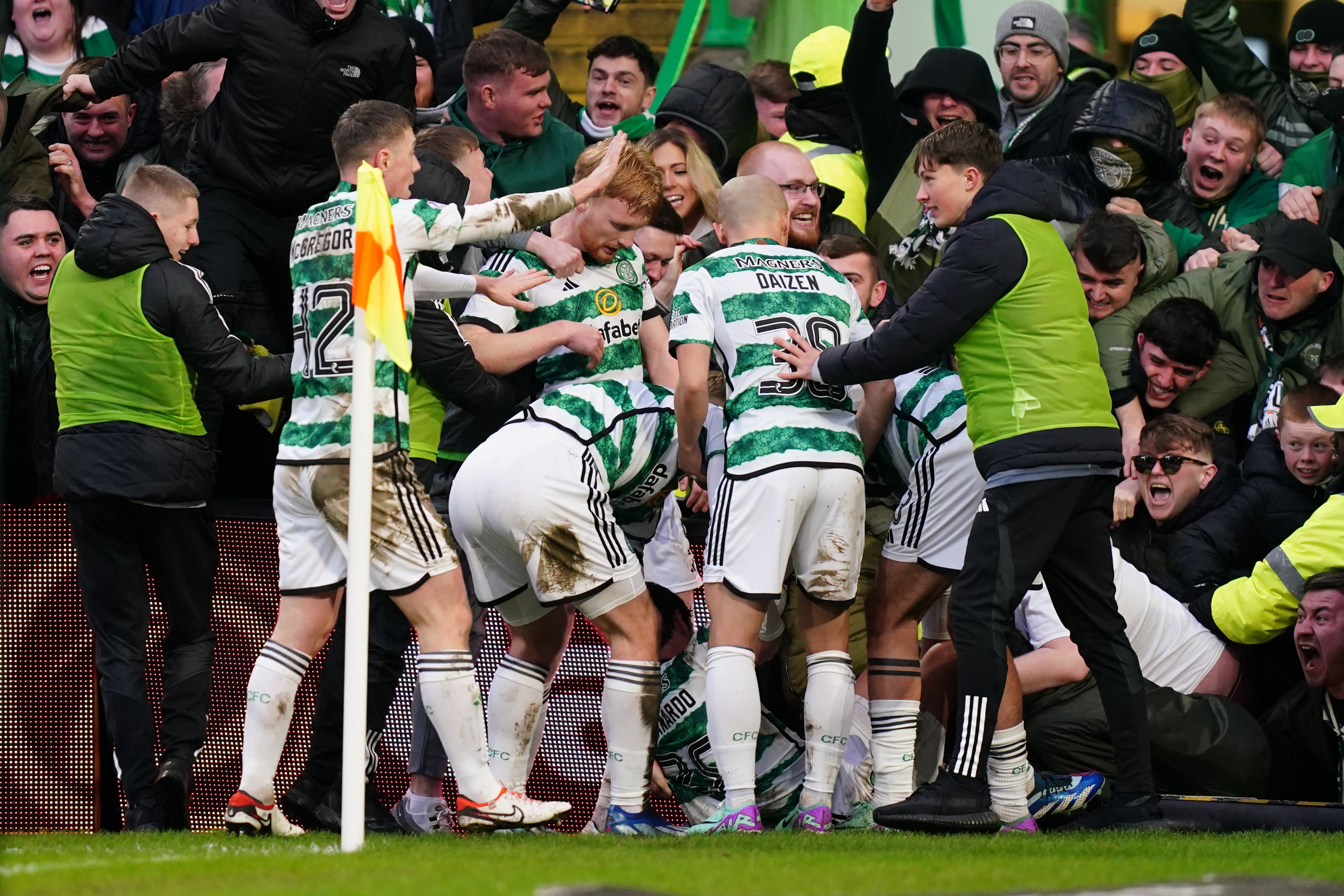 Celtic’s Paulo Bernardo, on the ground, celebrates his goal with team-mates