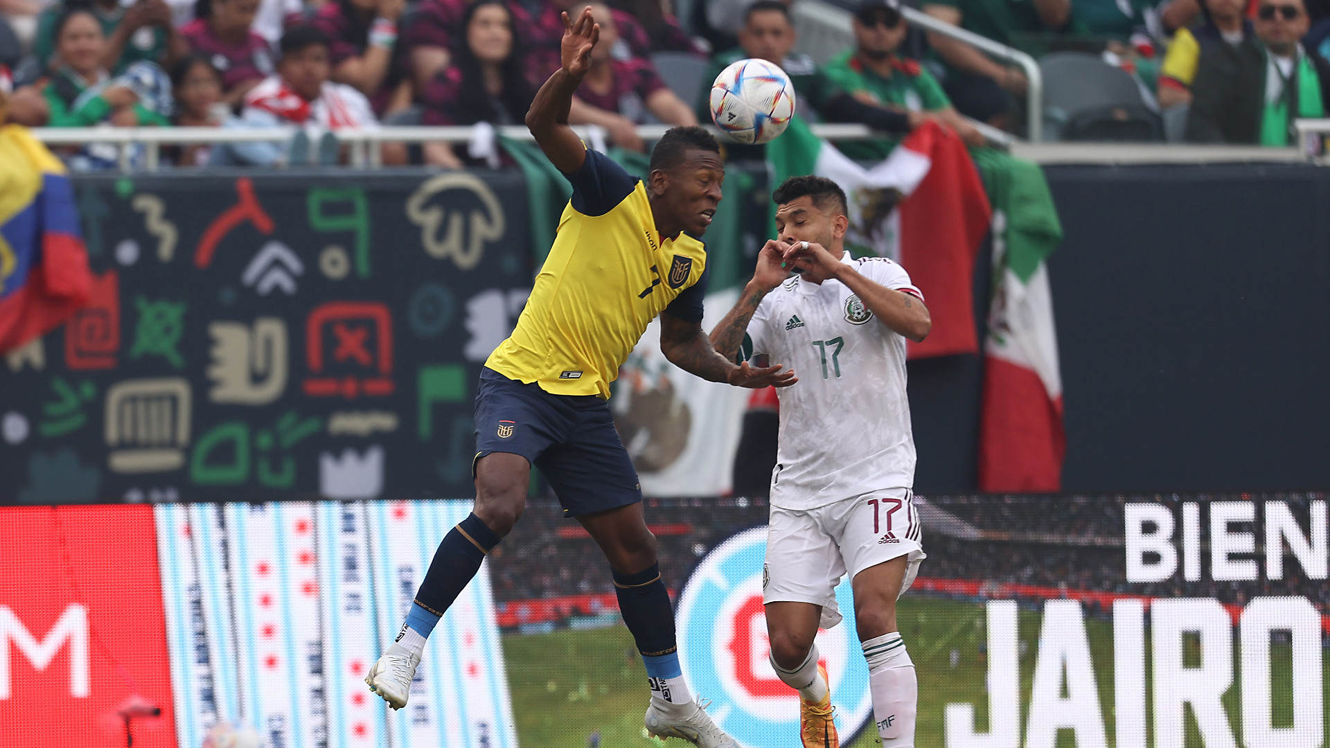 Ecuador's Pervis Estupinan (L) and Mexico's Jesus Corona (R)