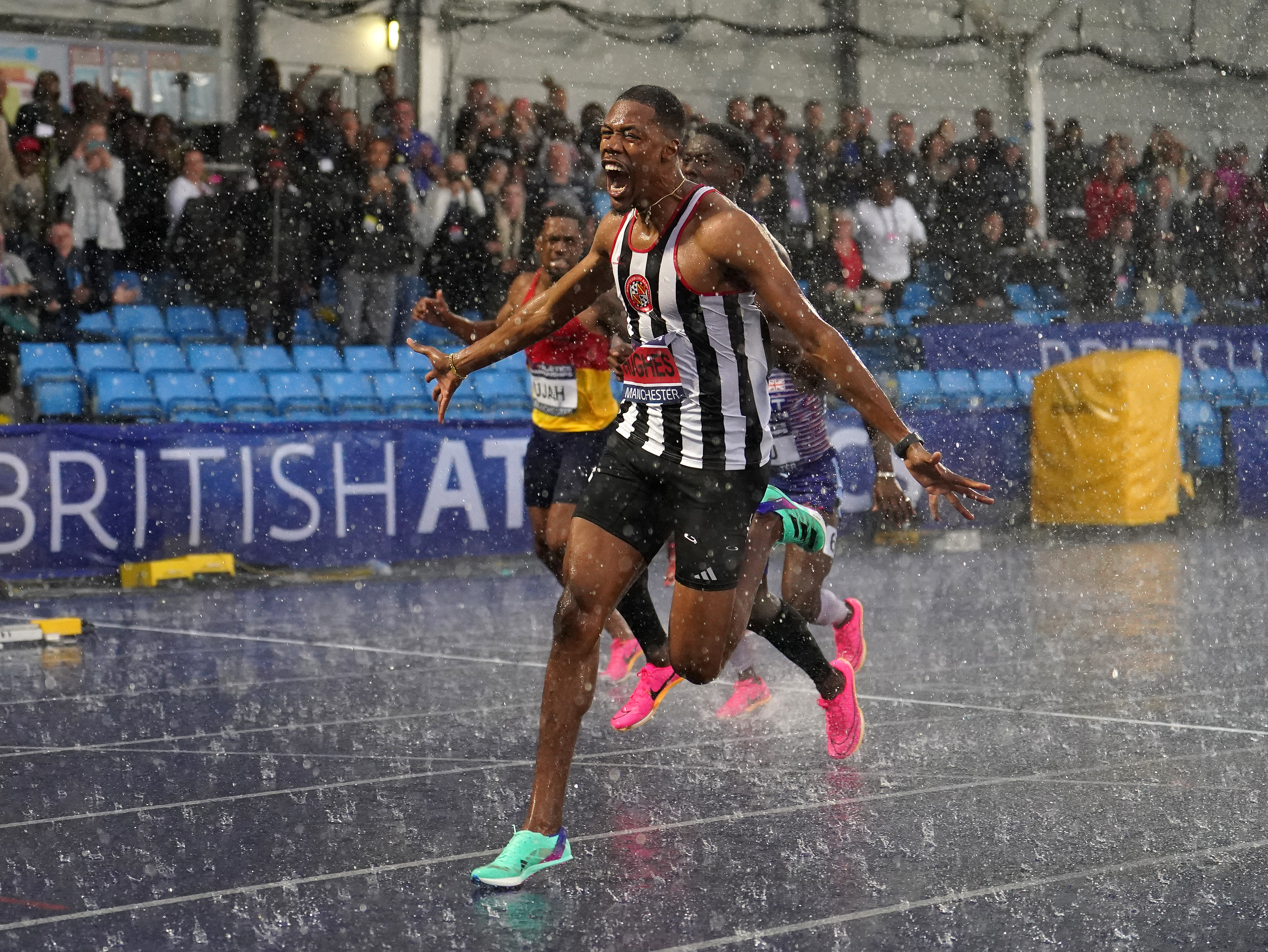 Zharnel Hughes wins a rainswept UK Athletics Championships 100m in Manchester