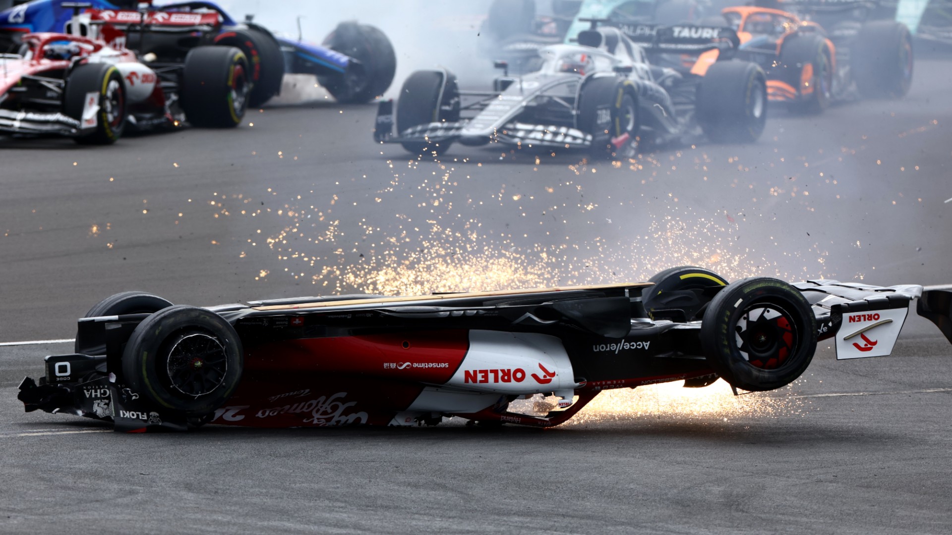 Zhou Guanyu's Alfa Romeo was sent skidding off while flipped