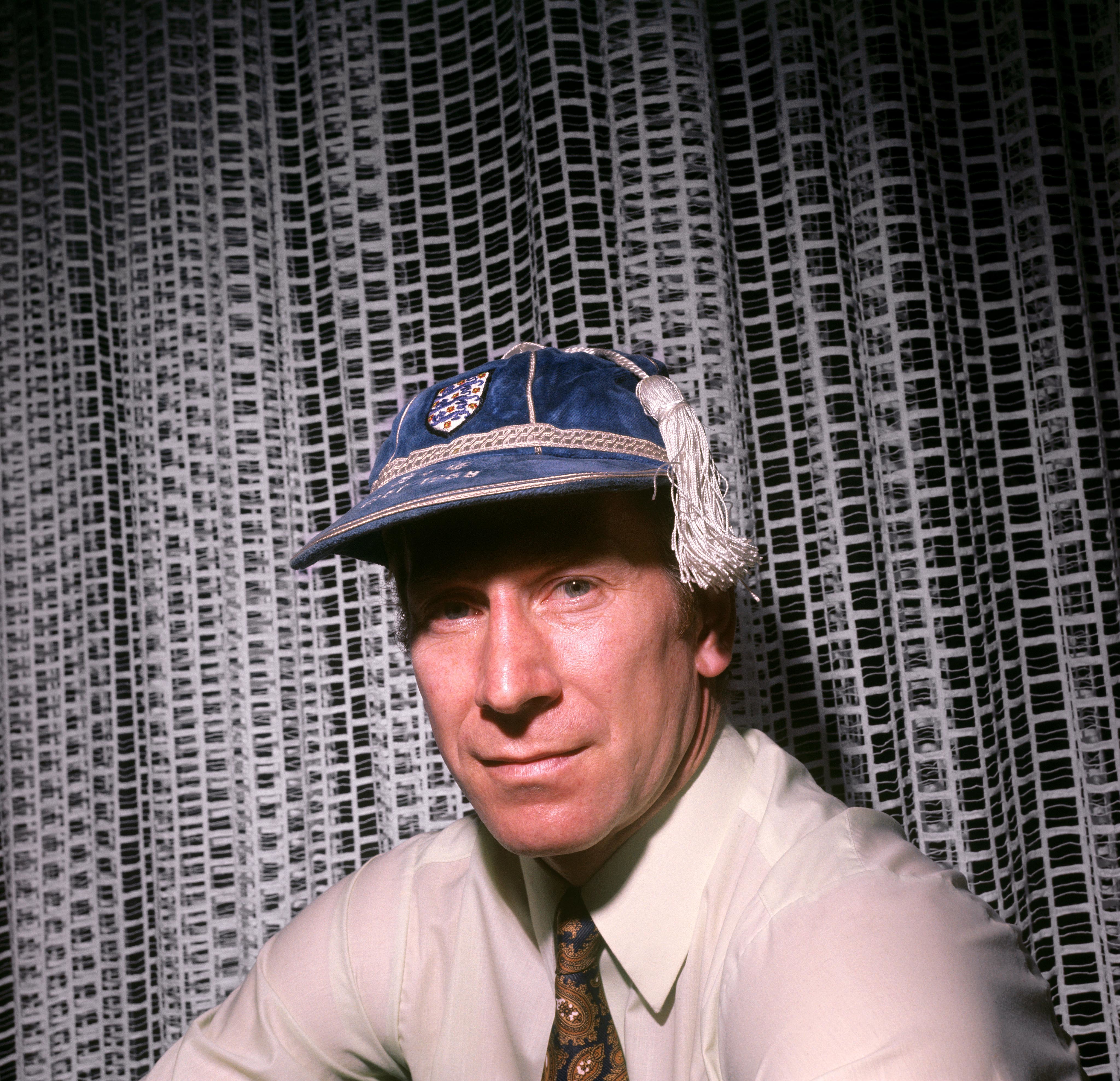 Sir Bobby Charlton, poses in his 100th England cap at home in Lymm, Cheshire