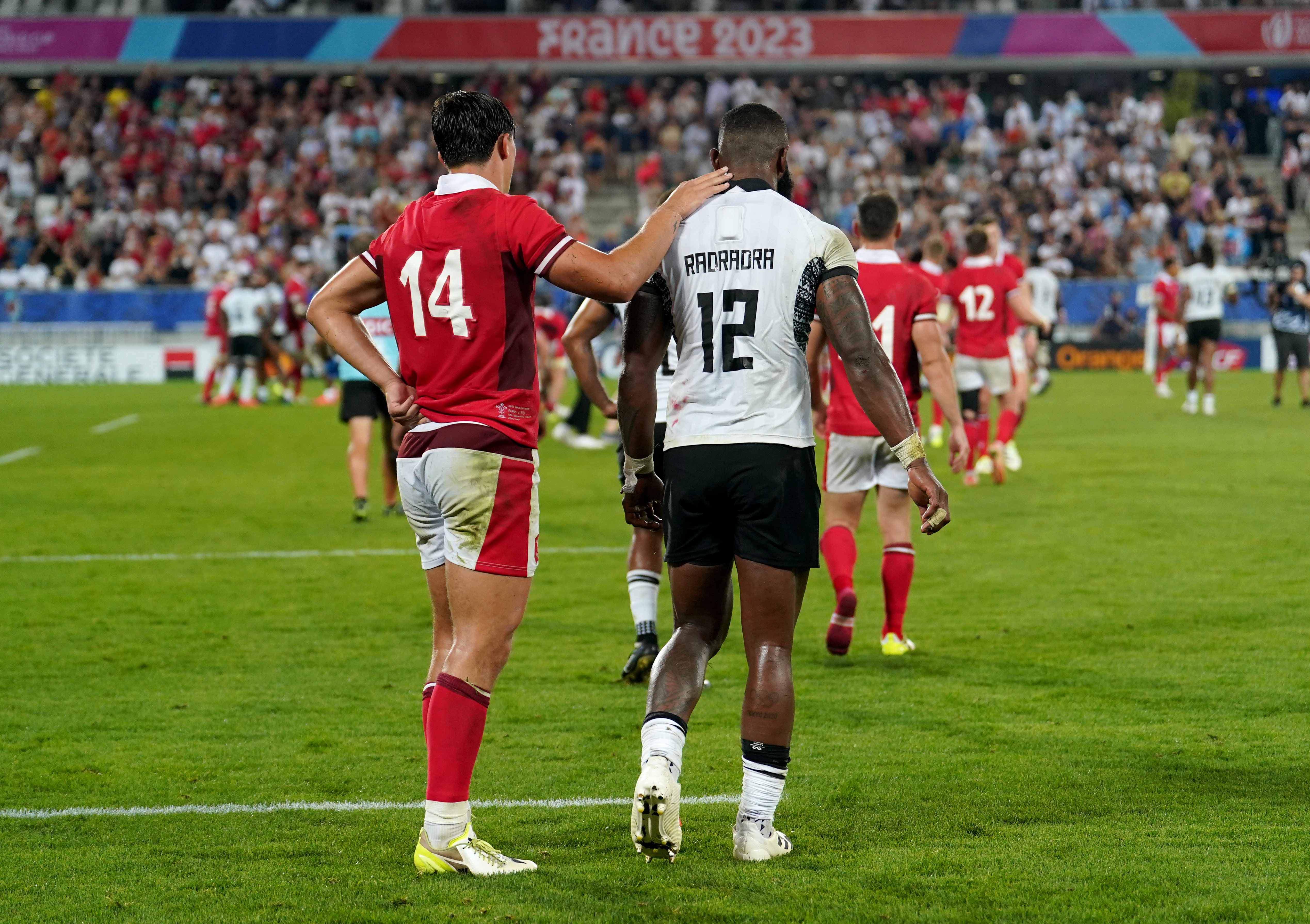 Louis Rees-Zammit consoled Semi Radradra at full-time