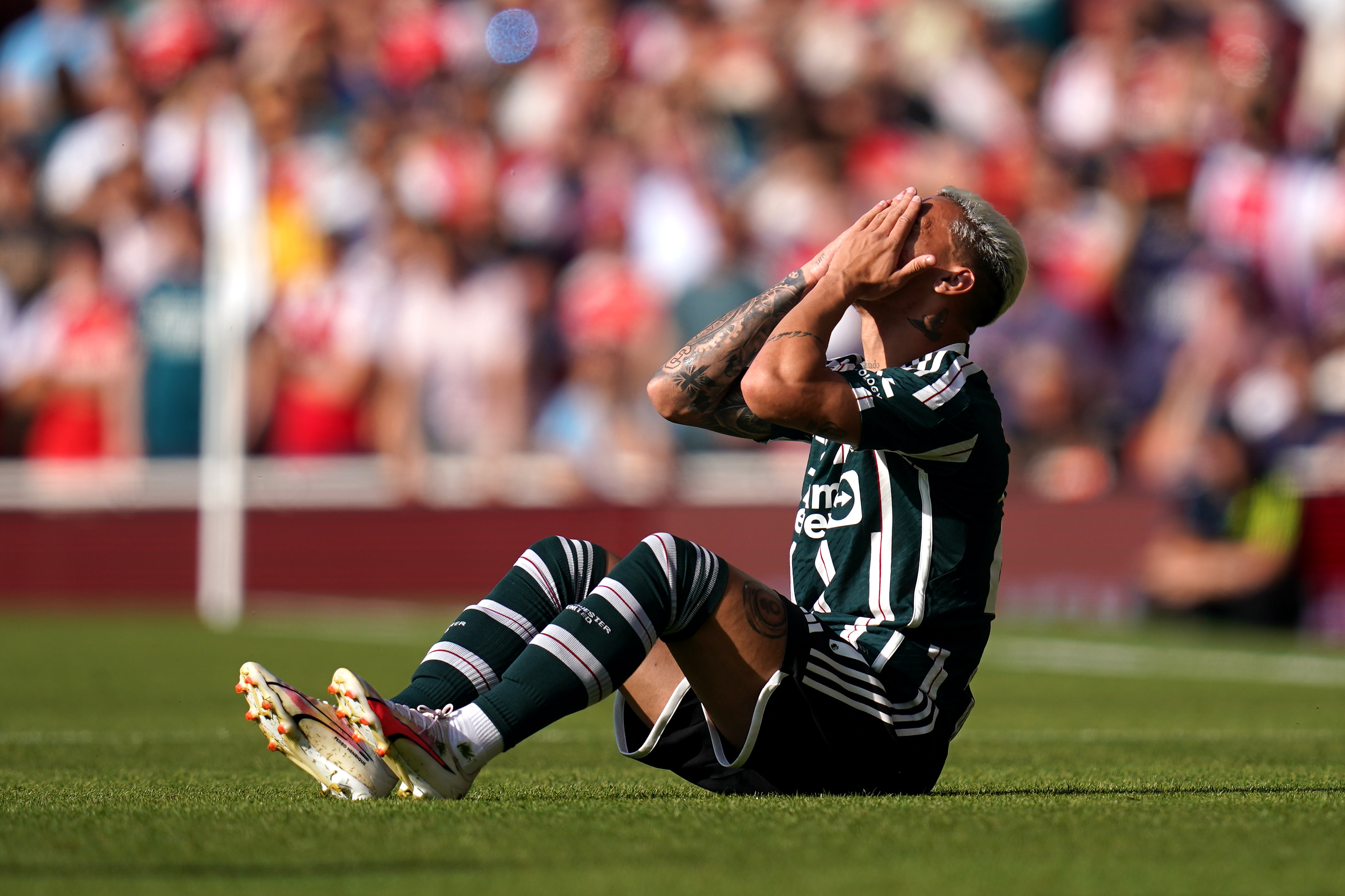 Manchester United’s Antony holds his head in his hands